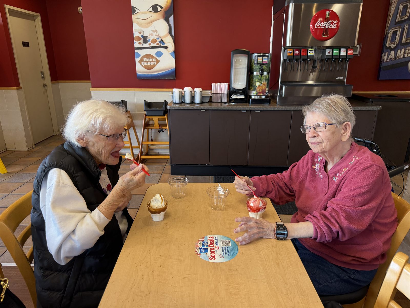 Two residents enjoying ice cream on an afternoon out